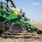 10 essential preseason planter checks for better yields blog header image showing tractor in a field