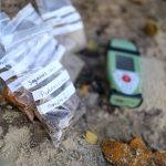 Soil sample bagged and written on by a Geologist, ready to be taken back to the laboratory to be dried and analysed